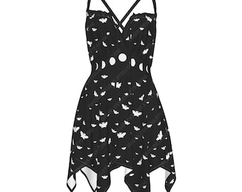 May include: Black dress with white bat and moon phase pattern. The dress features a V-neckline, spaghetti straps, and an asymmetrical hemline. The design includes a series of white bats and moon phases scattered across the fabric.