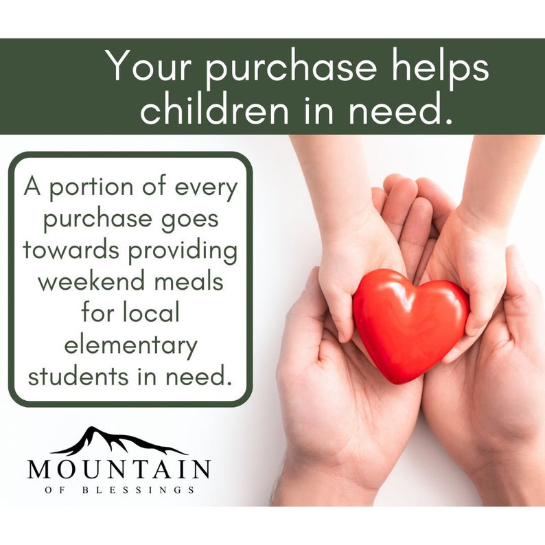May include: Two hands, one adult and one child, hold a red heart-shaped object. The text reads "Your purchase helps children in need. A portion of every purchase goes towards providing weekend meals for local elementary students in need. MOUNTAIN OF BLESSINGS."