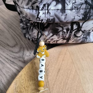 porte clé ecole, porte clé personnalisé, porte clé biche, porte clé dumbo, porte clé minnie baby, porte clé simbaa nala