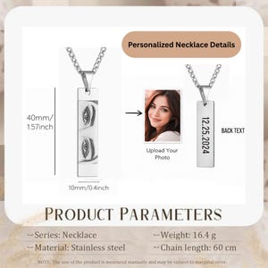 May include: A silver-toned rectangular pendant necklace featuring an engraved portrait of eyes on the front and the date 12.25.2024 on the back. The pendant measures 40mm by 10mm (1.57 inches by 0.4 inches) and hangs from a chain 60 cm in length.