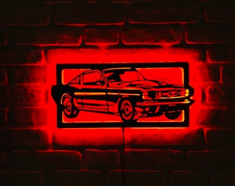 May include: A black silhouette of a classic car with red LED lights around the frame, mounted on a brick wall.