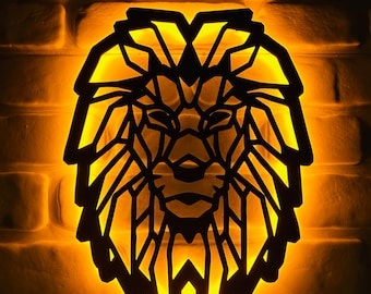 May include: A black geometric lion head wall lamp with a warm yellow glow. The lamp is made of wood and has a simple design.