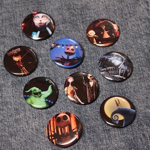 May include: Nine round buttons featuring characters and scenes from the movie The Nightmare Before Christmas. The buttons are colorful and feature characters like Jack Skellington, Sally, and Oogie Boogie.