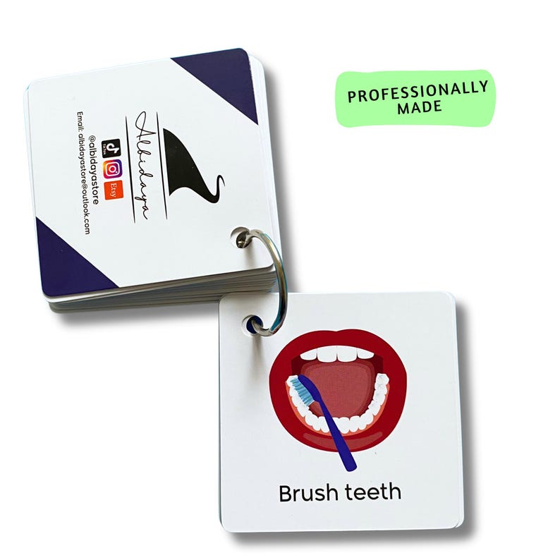 May include: A white card with a red mouth and a blue toothbrush brushing teeth. The text "Brush teeth" is below the image. The card is part of a set of flash cards for learning.