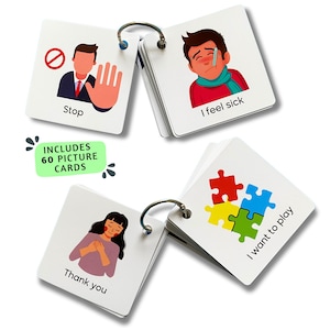 May include: A set of 60 picture cards with a ring binder. The cards feature various images and phrases, including "Stop", "I feel sick", "I want to play", and "Thank you".