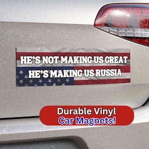 May include: A red, white, and blue American flag car magnet with the text "He's not making us great. He's making us Russia."  Durable vinyl car magnets.