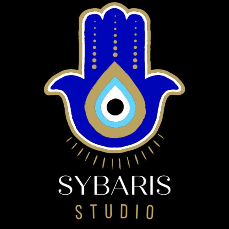 May include: A blue hamsa hand with a gold outline and a blue evil eye in the center. The hamsa hand is surrounded by gold rays. The text "SYBARIS STUDIO" is below the hamsa hand.