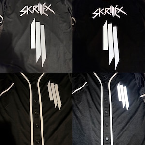 May include: Four images of a black baseball jersey with white trim and a white Skrillex logo. The logo is a stylized 'Skrillex' with three vertical bars.