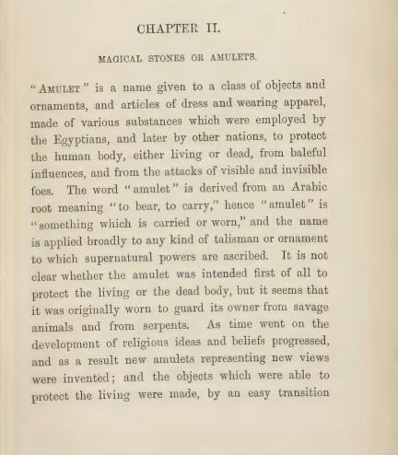 May include: Aged book page with the title "Chapter II. Magical Stones or Amulets." The text describes the history and purpose of amulets, their origins in ancient Egypt, and their use for protection.