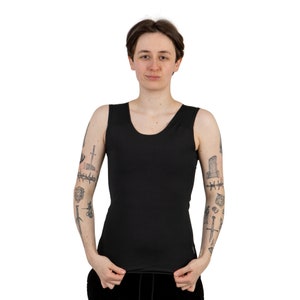 May include: A black sleeveless undershirt with a scoop neck.