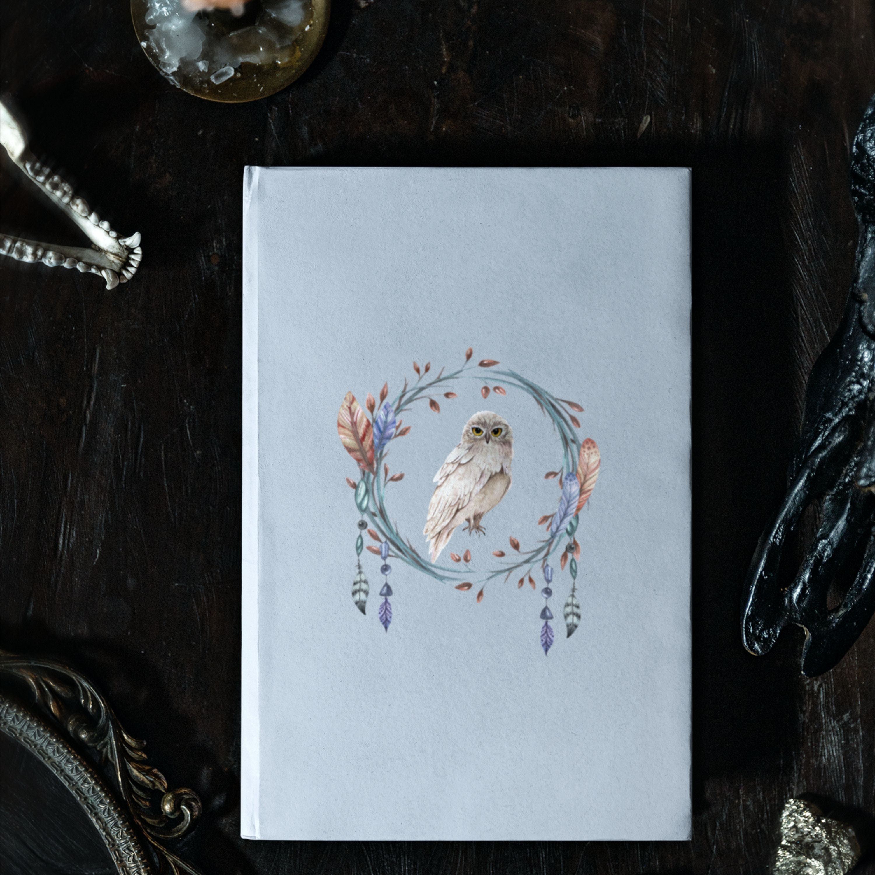 Hardcover Journal with a beautiful snowy white owl on the cover surrounded by flowers and feathers