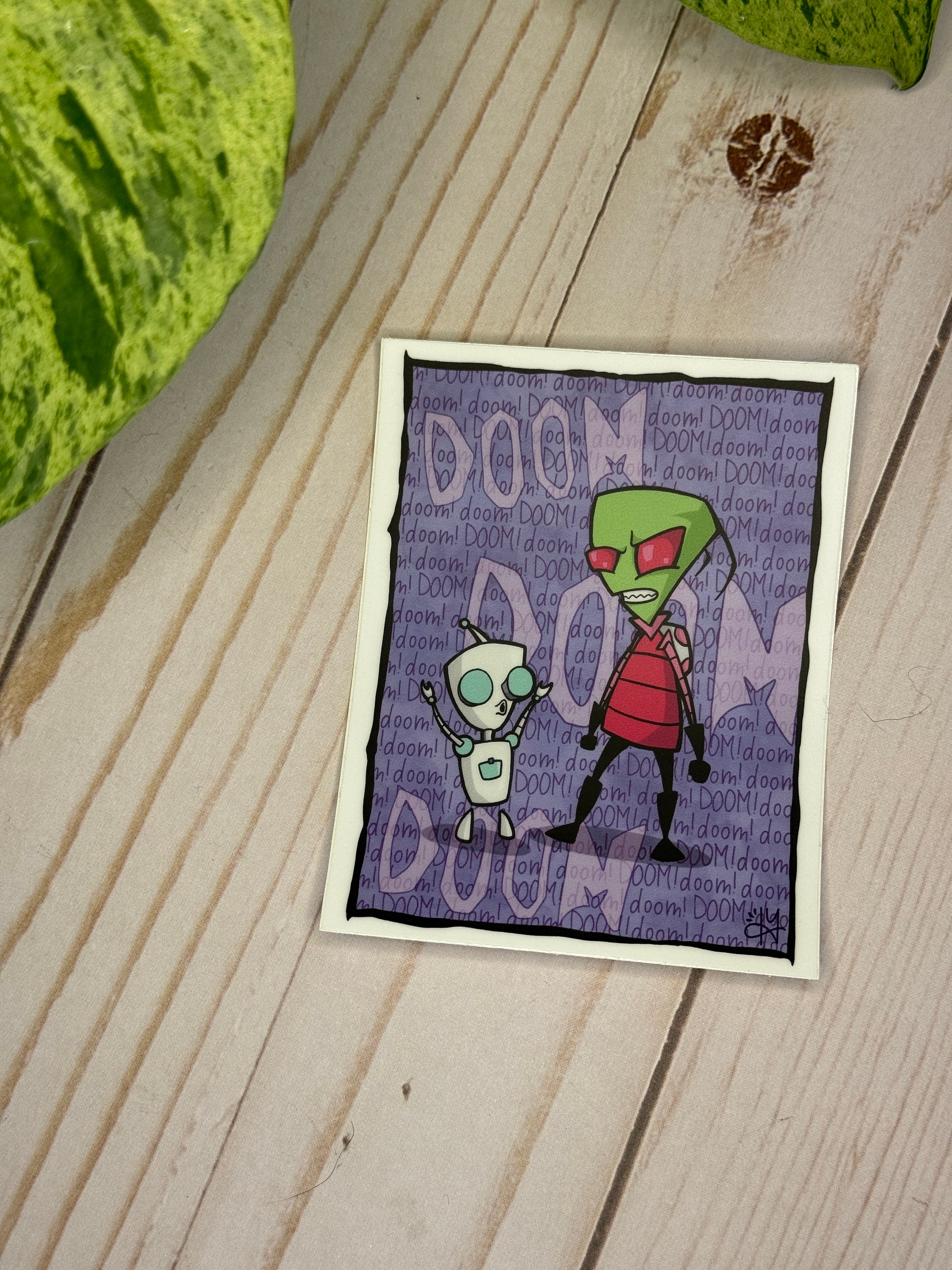 A fan art vinyl sticker featuring Gir from Invader Zim, with 'Doom Song' text, ready to be applied.