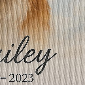 Angled close-up of the pet memorial canvas showing the printed name "Bailey" and dates, focusing on the texture and color fidelity of the canvas.