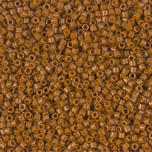 May include: Close-up of a pile of small, cylindrical, brown beads. The beads are uniform in size and shape, with a hole running through the center of each. The beads are tightly packed together, creating a textured surface. Ideal for jewelry making and crafts.