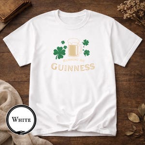 Funny Running on Guinness St Patrick’s Day shirt featuring a beer mug and shamrock design printed on Gildan 5000 unisex t shirts available in black white Irish green and antique Irish green colors, humorous Irish drinking shirt perfect for St Paddy’s Day pub crawls parties festivals and Irish holiday celebrations.