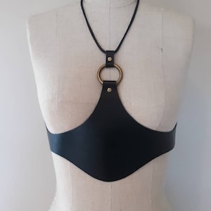 THE GUARDIAN is a beautiful, unique, original, handcrafted, quality leather under-bust harness / belt / corset as worn by Chappel Roan band