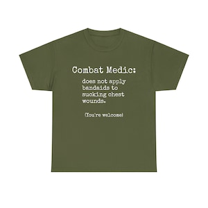 May include: A green t-shirt with the text "Combat Medic: does not apply bandaids to sucking chest wounds. (You're welcome)"