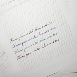 May include: A close-up of a lined notebook page with the phrase "Know your worth, then add tax!" written four times in different colors of ink.