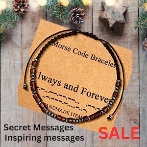 May include: A brown and silver beaded bracelet with a black cord. The bracelet has the words "Morse Code Bracelet" and "Always and Forever" written on the card. The card also says "Handmade Item".