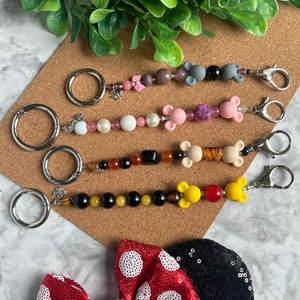 Ear Holder Keychain with Carabiner. Hands-Free Travel Accessory. A Must for Days at the Parks!