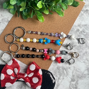 Ear Holder Keychain with Carabiner. Hands-Free Travel Accessory. A Must for Days at the Parks!