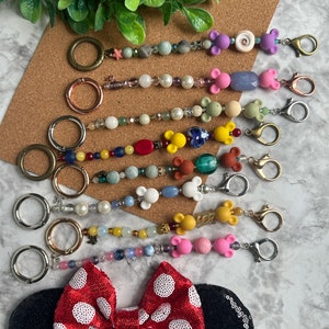 Ear Holder Keychain with Carabiner. Hands-Free Travel Accessory. A Must for Days at the Parks!