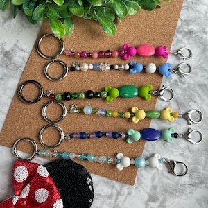 Ear Holder Keychain with Carabiner. Hands-Free Travel Accessory. A Must for Days at the Parks!