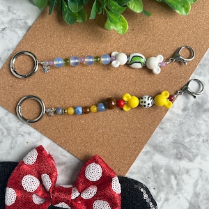 Ear Holder Keychain with Carabiner. Hands-Free Travel Accessory. A Must for Days at the Parks!