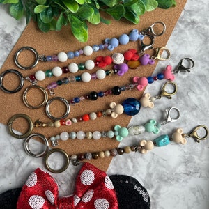 Ear Holder Keychain with Carabiner. Hands-Free Travel Accessory. A Must for Days at the Parks!