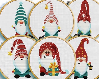May include: Six different cross-stitch patterns featuring cute gnomes with various hats and accessories. The patterns are displayed in embroidery hoops.
