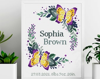 May include: Cross-stitch embroidery design featuring a floral wreath with two yellow butterflies and the name "Sophia Brown" with the date "27.03.2021" and the weight and length "8lbs 7oz 20in."