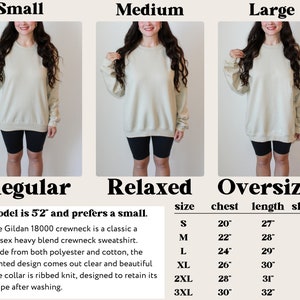 May include: A size chart for a unisex crewneck sweatshirt in beige. The chart shows the measurements for chest, length, and sleeve in inches for sizes S through 3XL. The text states that the model is 5'2" and prefers a small.
