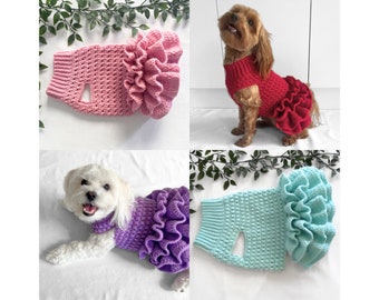 May include: Four crocheted dog sweaters in different colors: pink, red, purple, and light blue. Each sweater has a large ruffle around the bottom.