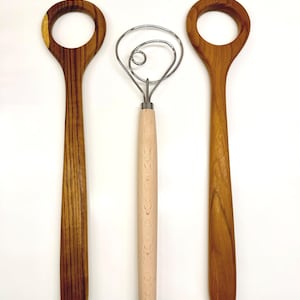 Size comparison of the teakwood dough whisk and the metal dough whisk.