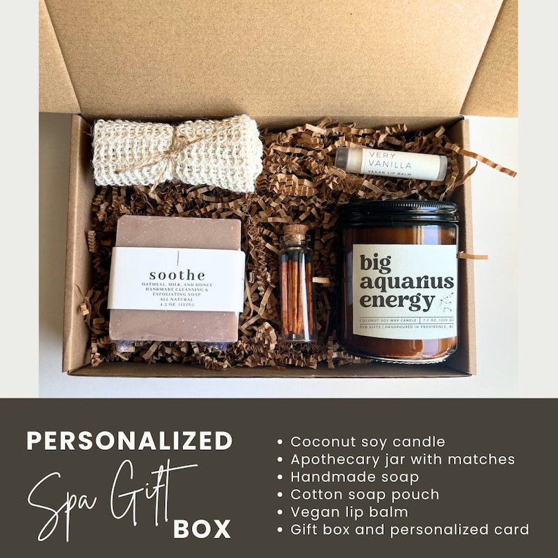 May include: A personalized spa gift box with a coconut soy candle, apothecary jar with matches, handmade soap, cotton soap pouch, and vegan lip balm. The box includes a personalized card.