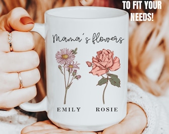 May include: White ceramic mug with a floral design and the text "Mama's flowers" with the names "Emily" and "Rosie" underneath the flowers.