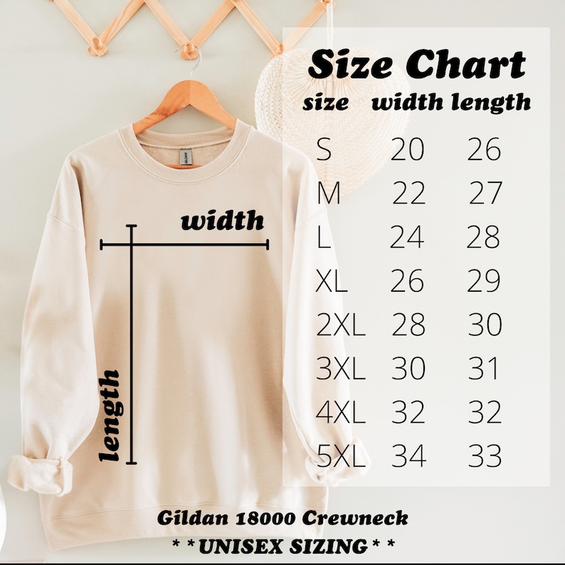 May include: A size chart for a Gildan 18000 Crewneck sweatshirt, showing the width and length measurements in inches for sizes S through 5XL. The chart is printed on a beige sweatshirt.