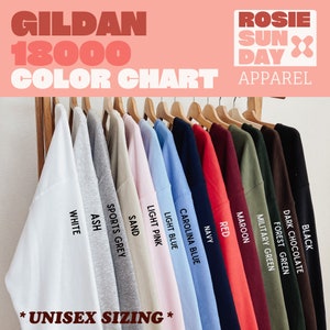 May include: Color chart for Gildan 18000 t-shirts, showing 12 different colors: white, ash, sports grey, sand, light pink, light blue, carolina blue, navy, red, maroon, military green, forest green, and dark chocolate. The chart includes the text "*UNISEX SIZING*" at the bottom.