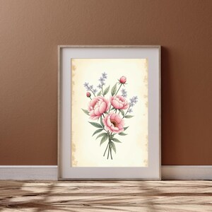 Könnte beinhalten: Ein gerahmter Druck eines Aquarells mit einem Strauß rosa Pfingstrosen und helllila Blüten auf cremefarbenem Hintergrund.