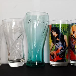 Different Coca-Cola Light collectible glass. Coca-Cola bell-shaped glasses. Coca-Cola collectibles. Vintage barware. Rare Coke glasses.