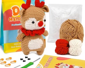 May include: A DIY crochet kit featuring a brown and white reindeer with red antlers and a red collar. The kit includes yarn, a crochet hook, and a booklet titled "The Deer". The packaging is a blue and yellow bag with the words "DIY Hands" on it.