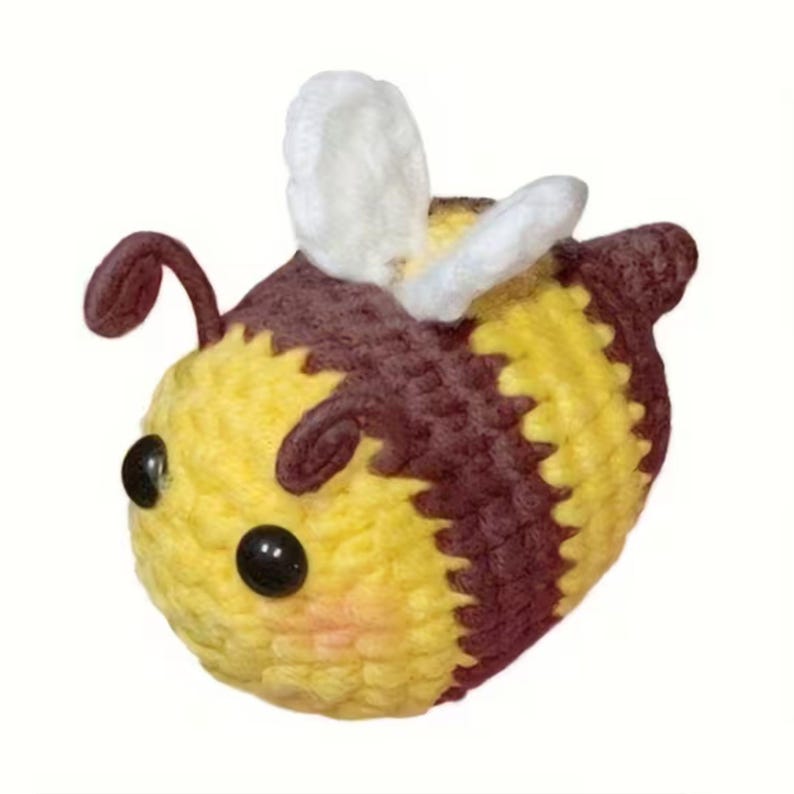 Cute bee brown, white, black and yellow crochet kit doll.