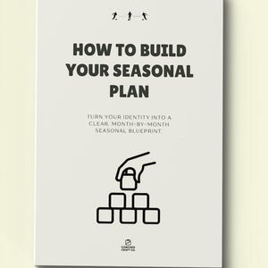 May include: A white book cover with the title "HOW TO BUILD YOUR SEASONAL PLAN" in bold black letters. Below, the text reads "TURN YOUR IDENTITY INTO A CLEAR, MONTH-BY-MONTH SEASONAL BLUEPRINT." The cover features a black graphic of a hand placing a lock on a stack of blocks.