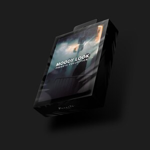 May include: A black box with a clear plastic cover, showcasing a collection of presets called "Moody Look". The box has a white label with the text "Moody Look Presets Collection" and the word "Presets" in a stylized font.