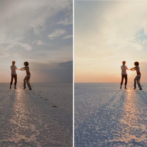 May include: Two people silhouetted against a sunset, holding hands and spinning on a white, sandy beach.