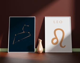 May include: Two framed prints featuring a gold constellation design and the word "LEO" on a white background. The constellation print has a dark blue background.