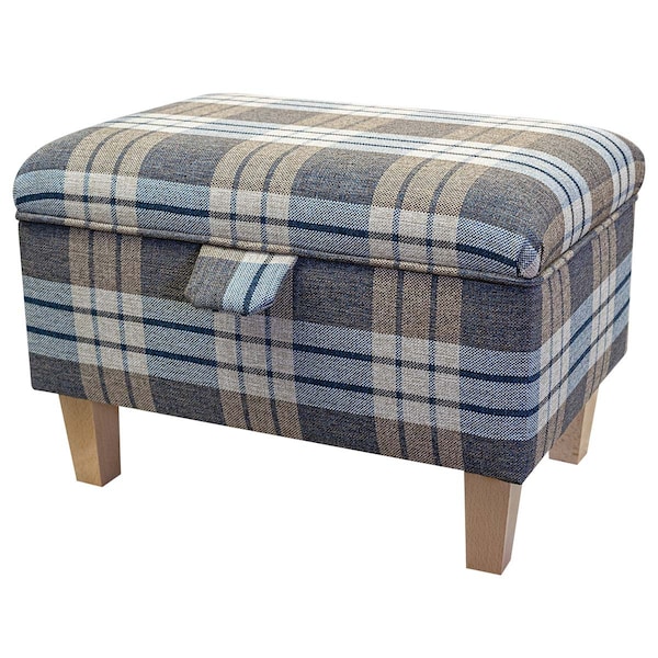 May include: A rectangular storage ottoman with a plaid fabric cover in shades of blue, brown, and white. The ottoman has wooden legs and a hinged lid.