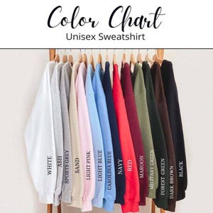 A color chart displaying various colored sweatshirts hanging on a rack, with each color labeled.