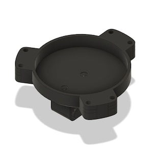 Puede incluir: Base de plástico negro con tres brazos y un centro circular. La base tiene una superficie lisa y redondeada y un acabado ligeramente texturizado.