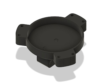May include: Black plastic base with three arms and a circular center. The base has a smooth, rounded surface and a slightly textured finish.